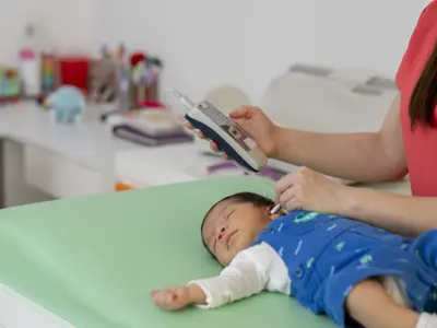 Baby undergoing hearing screening test