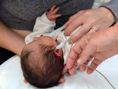 Baby undergoing hearing screening test